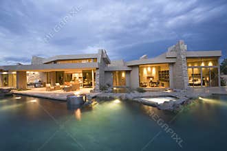 Swimming Pool And Illuminated Modern House