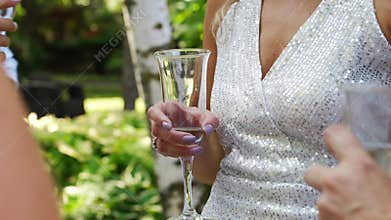 women in white dresses with glasses of champagne. Bachelorette party.