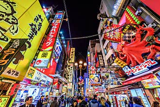 Osaka, Japan - November 11, 2023 : Crowd of people walking at Dotonbori the famous tourist destination in Dotonbori canal,