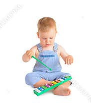 Cheerful baby boy and xylophone
