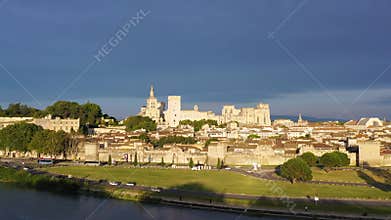 View of Avignon with Palais des Papes during sunset in Southern France. Medieval architecture along the Rhone River in Avignon,