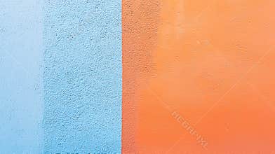 Freshly painted wall showcasing textured surface with blue and orange colors, adding modern touch to solid backdrop