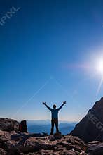 Women silhouette on the top of mountain