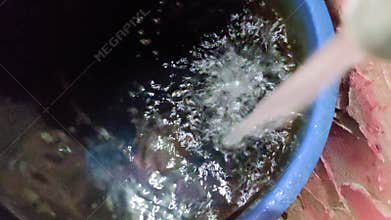 Rain falls into a basin