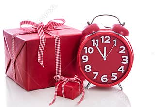 Christmas: big red gift box with red alarm clock - last minute c