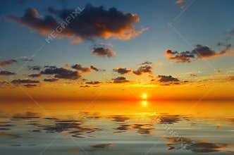 Ð¡alm sunset with occasional clouds