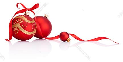 Red christmas decoration balls with ribbon bow on white