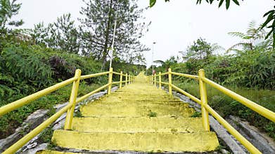 down the very long and tiring yellow stairs. Photo hunting on Mount Galunggung, Tasikmalaya