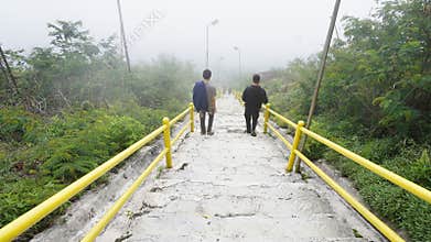 TASIKMALAYA, INDONESIA - 27 NOVEMBER 2024 - down the yellow stairs on Mount Galunggung Tasikmalaya