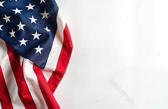 American flag draped on plain white background. Patriotic symbol of US. Suitable for Independence Day memorial events. Classic
