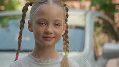 Happy glad smiling Caucasian little child kid school girl pupil looking at camera smile schoolgirl orphan adoption