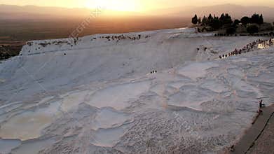 Aerial view of the travertines in Pamukkale in a beautiful sunset, Turkey. White limestone mineral formations. Turkish