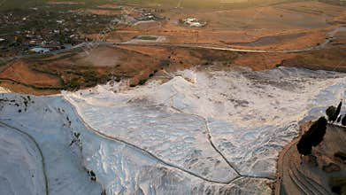 Aerial view of the travertines in Pamukkale, Turkey. White limestone mineral formations.