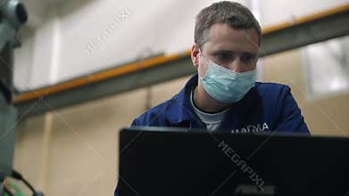 2021-09-23 - Mariupol, Ukrane. Magma factory. Pro inspects workpiece with coordinated measuring machine, industry