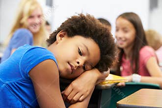 Unhappy Girl Being Bullied In Class