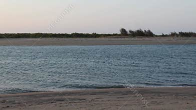 A video of the tide rushing in powerfully into a river estuary