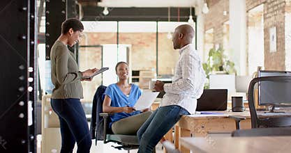 Diverse business professionals collaborate in a modern office