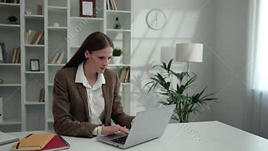 Young Charming Business Lady Working at Home Using Laptop.