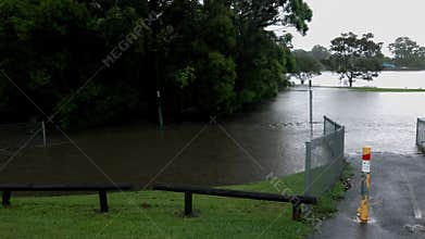 Flood water completely submerging a sport park after a flash flood in Queensland.