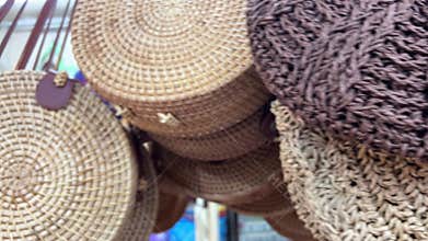 wicker bags Handmade wicker baskets to sell in the supermarket. Traditions of weaving. Eco-friendly natural products.