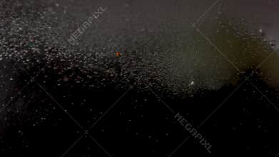 Close-Up of Bath Bombs Dissolving in Water With Vivid Colors