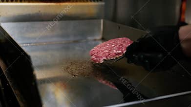 Flipping A Cooking Hamburger On The Grill, Slow Motion