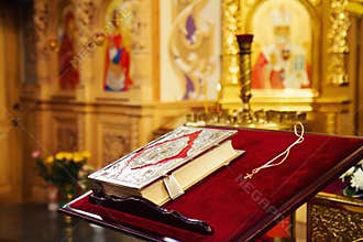 Holy Bible and Orthodox cross in orthodox church