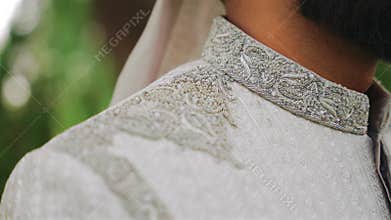 Inside the Indian wedding, the bridegroom brides together and worships the Lord. Happy indian groom handsome portrait