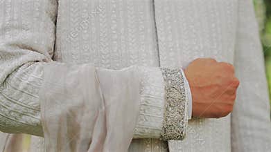 Inside the Indian wedding, the bridegroom brides together and worships the Lord. Happy indian groom handsome portrait