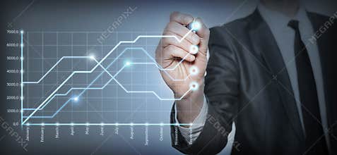 Businessman draws a graph