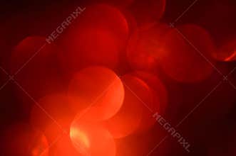 Blurred, bokeh red lights background. Abstract sparkles
