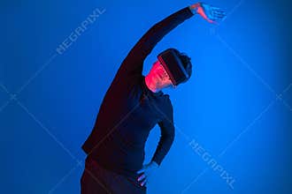 Smart sportman player wearing VR stretching whole body posing. Contrivance.