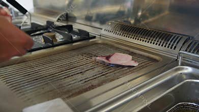 Chef Cooking Grilled Swordfish Fish in Restaurant