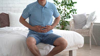 Stomach ulcer, man with abdominal pain suffering at home, symptoms of gastritis, diseases of the digestive system