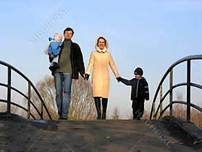 Family of four on bridge