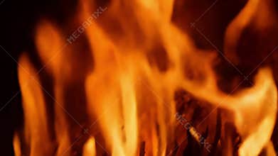 The flames flicker and crackle forming unique and unpredictable patterns that seem to defy gravity..