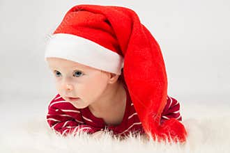 Baby boy in Santa Claus cap
