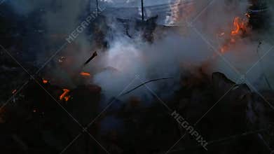 Footage of flames burning leaf waste