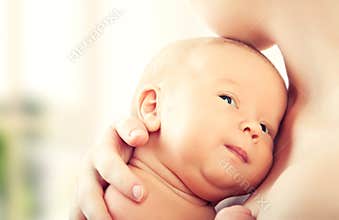Newborn baby in the arms of mother