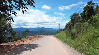 Backpacking trip by motorbike, hyper lapse landscape with winding moutain pass from motorcycle view when moving fast in high speed