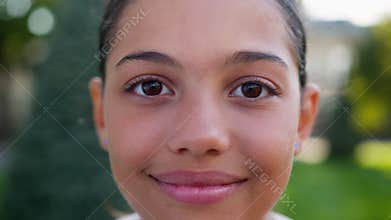 Close up girl little kid child pretty american indian latino student gen z teenager happy smiling face youth orphan teen