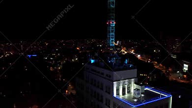 Aerial night illuminated Derzhprom top arc flight