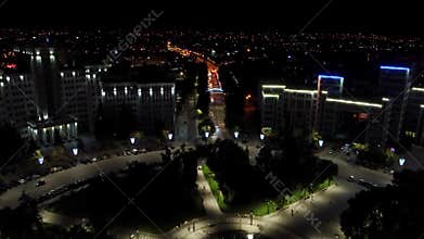 Aerial night illuminated Kharkiv city center dolly
