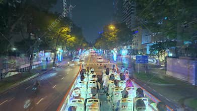 Nighttime cityscape on double decker bus