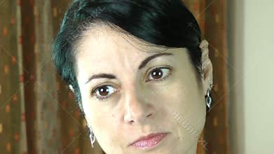 Woman gestures a bad smell with her hands.