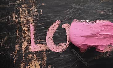 Handwritten LOVE in soft cursive style, with pink chalk texture on a rustic blackboard background