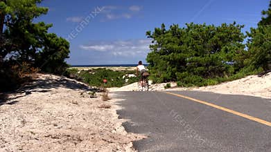 Woman bikes trail Provincetown Cape Cod
