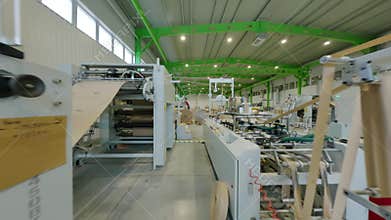 Papermaking plant workshop with huge rolls and strips FPV