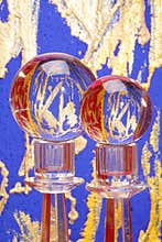 Two crystal balls on pedestals