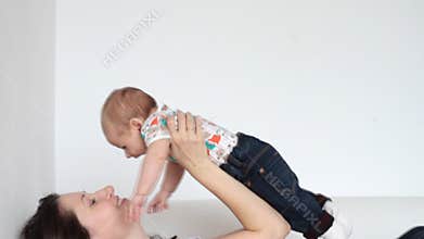 Mother playing with baby